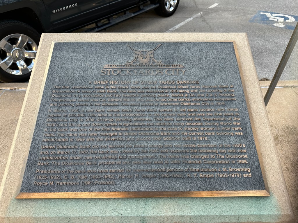 Plaque detailing the history of banking at Stockyards City, Oklahoma, including the establishment of the first commercial bank in 1910, its evolution, and notable events in its history.