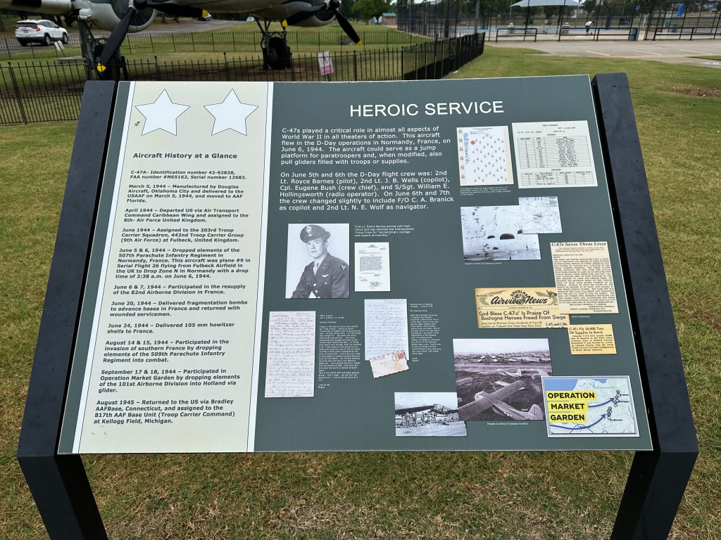 Information plaque detailing the history and service of C-47 aircraft including notable missions, crew members, and contributions during World War II.