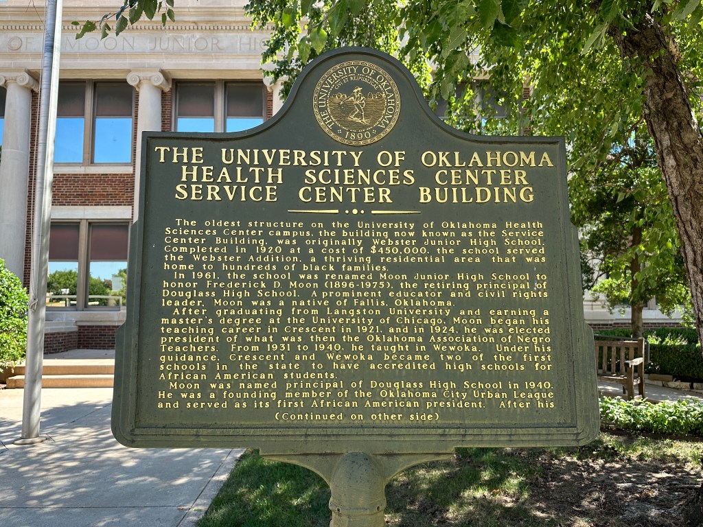 Historic marker at the University of Oklahoma Health Sciences Center Service Center Building, providing information about its history and significance.