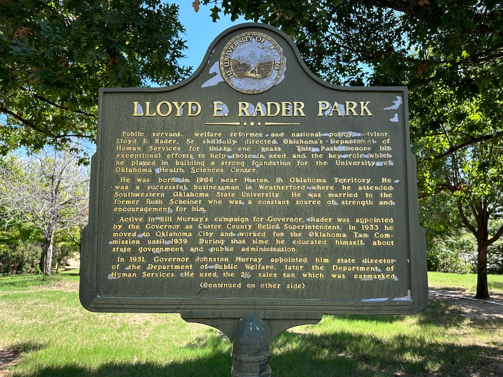 Historic marker for Lloyd E. Rader Park, honoring his contributions to Oklahoma's Department of Human Services and the University of Oklahoma Health Sciences Center.