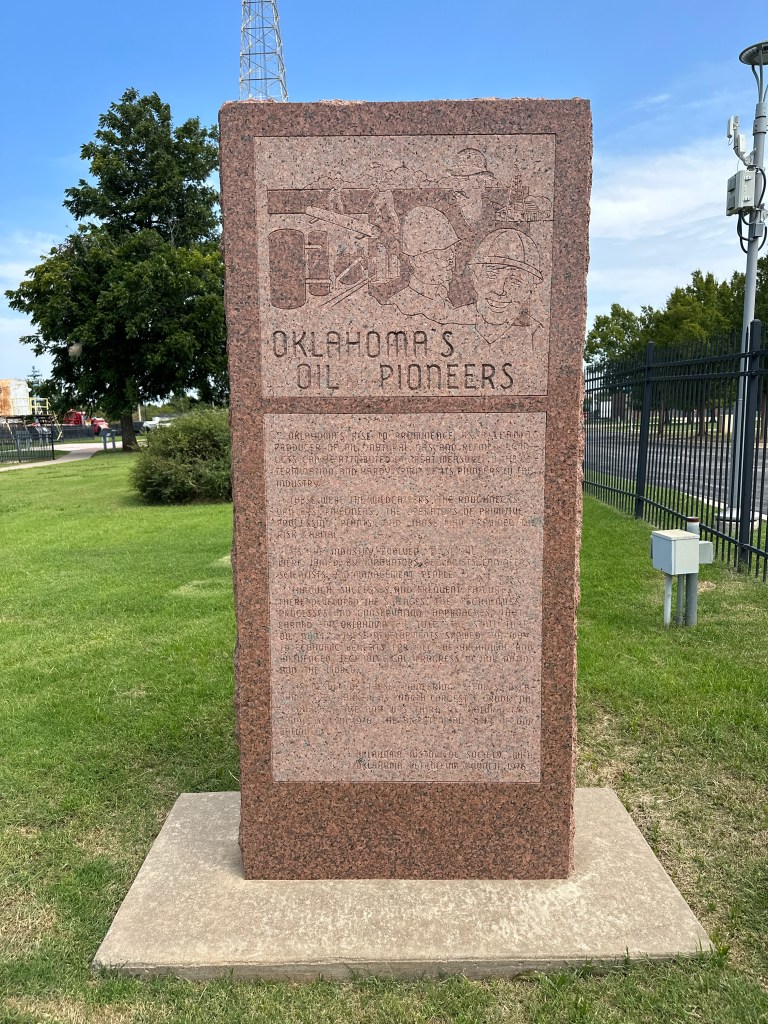 Historic marker honoring Oklahoma's Oil Pioneers at the Oklahoma History Center Museum in Oklahoma City, featuring inscriptions about the contributions of early oil industry pioneers.