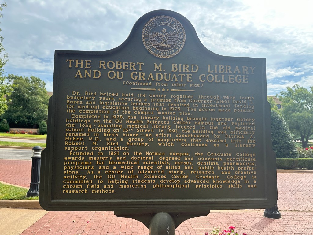 Historic marker detailing the history of the Robert M. Bird Library and OU Graduate College at the University of Oklahoma Health Sciences Center.