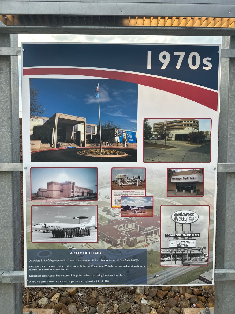 Historical sign about the 1970s in Midwest City, highlighting key developments like Rose State College and Tinker Air Force Base, accompanied by images of local landmarks.
