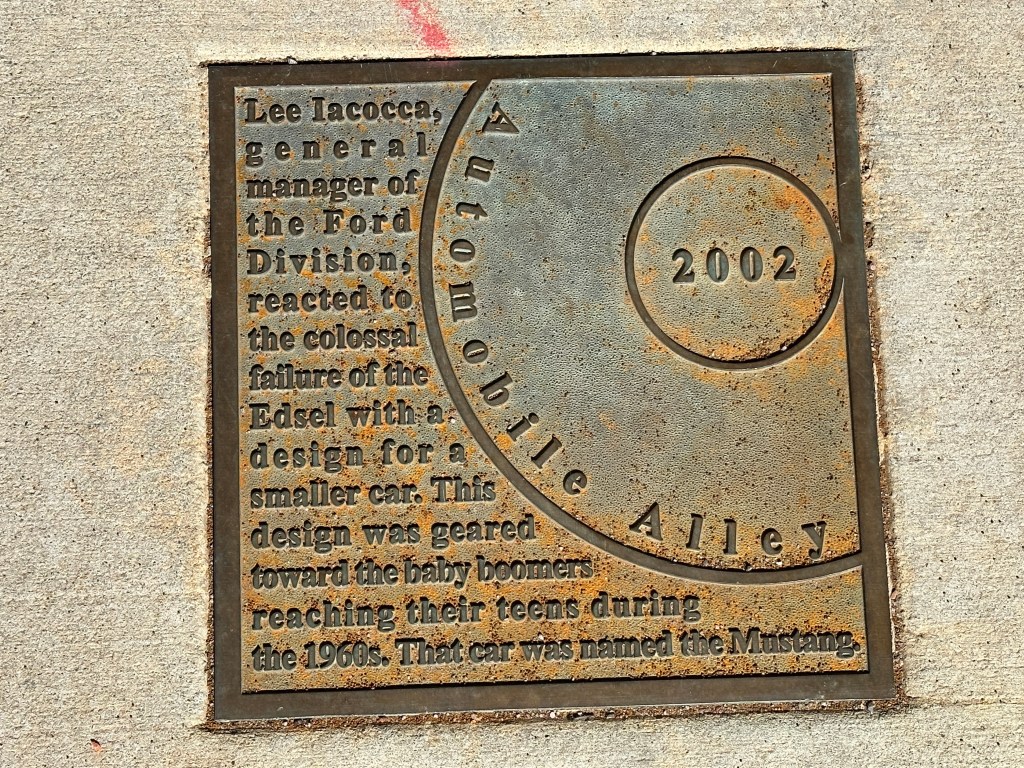 A historic marker plaque in the Automobile Alley Historic District, Oklahoma City, detailing Lee Iacocca's response to the Edsel's failure and the introduction of the Mustang.