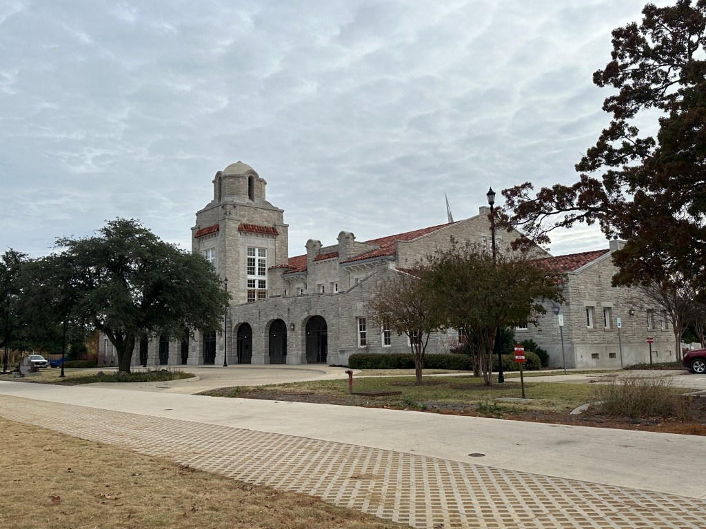 Exterior view of the historic Union Station in Oklahoma City, showcasing the stone architecture and distinctive tower.