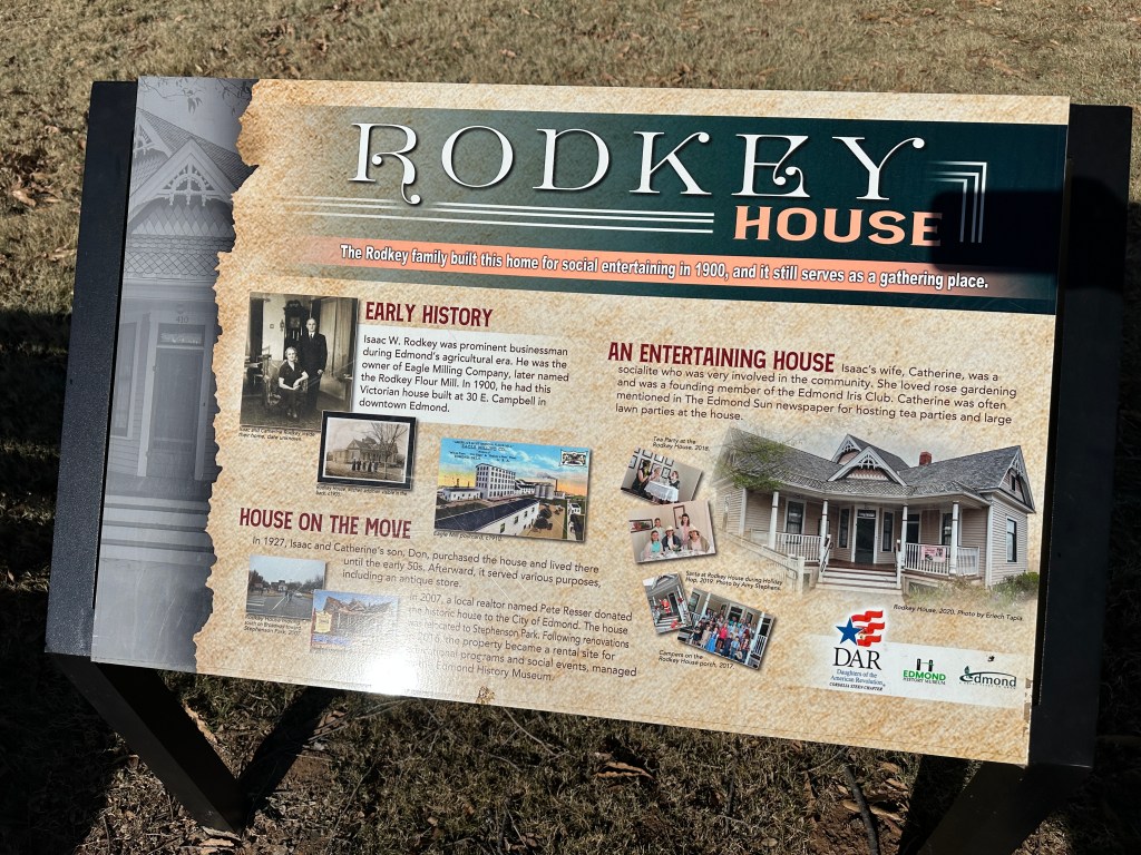 Information sign for the Rodkey House in Edmond, Oklahoma, outlining its early history and significance as a social gathering place.