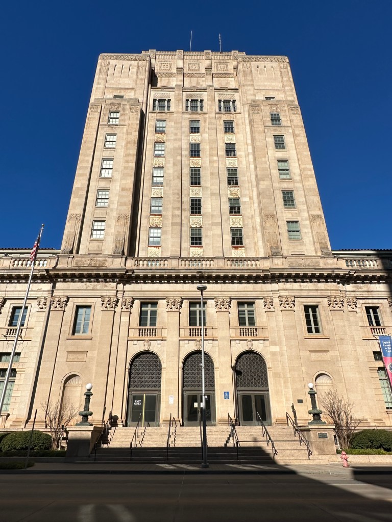 Facade of the historic U.S. Post Office, Courthouse, and Federal Building in Oklahoma City, showcasing Beaux Arts design and a nine-story tower.