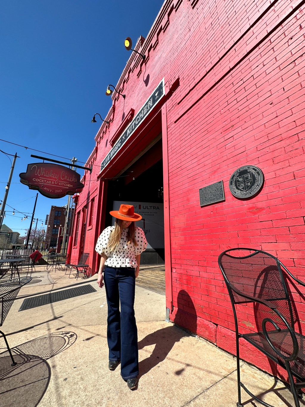 Kaitlyn stands in front of the historic Wells Fargo Stable in OKC. It is currently a restaurant.