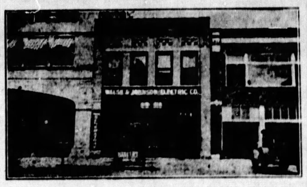 Historic black and white image of the Magnolia Petroleum Company building, showcasing its architecture and signage.