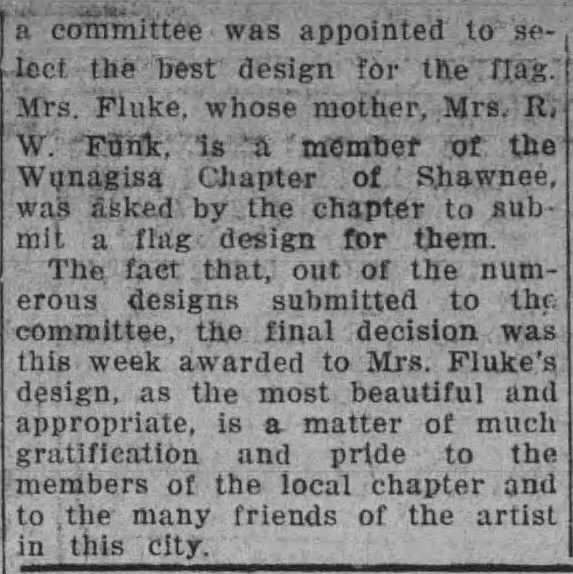 An article discussing the selection of a flag design by a committee, highlighting Mrs. Fluke's award for the most beautiful design submitted.