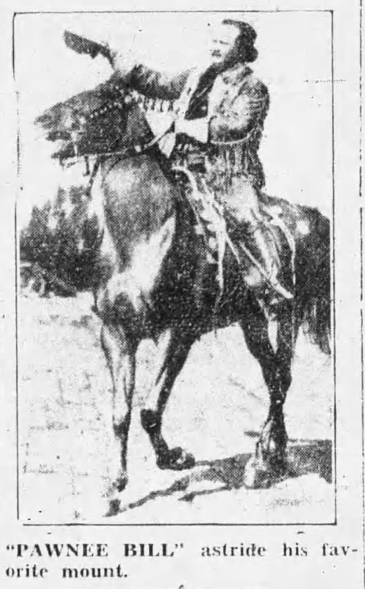 "Pawnee Bill" riding his favorite horse, waving a hat.